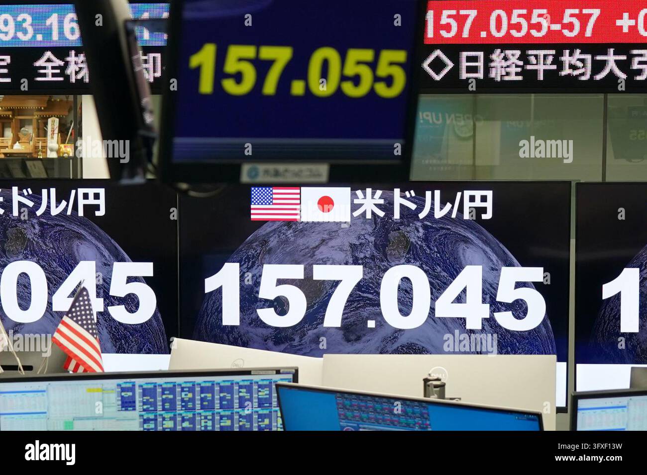 An electronic board displays the Japanese yen's exchange rate against ...