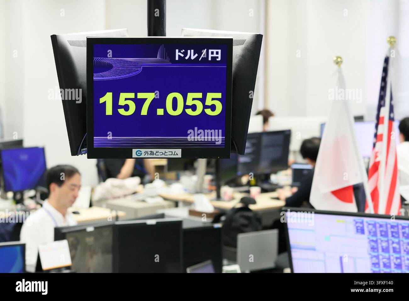 An electronic board displays the Japanese yen's exchange rate against ...