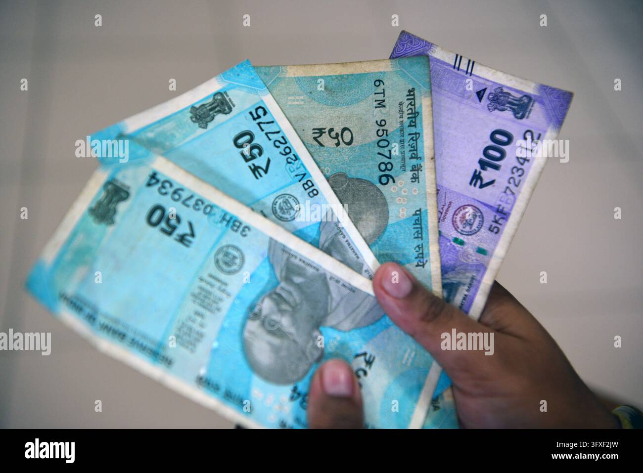Five Rupees Note Tectocr October 23, 2026, Siliguri, West Bengal, India: An Indian boy holds as ...