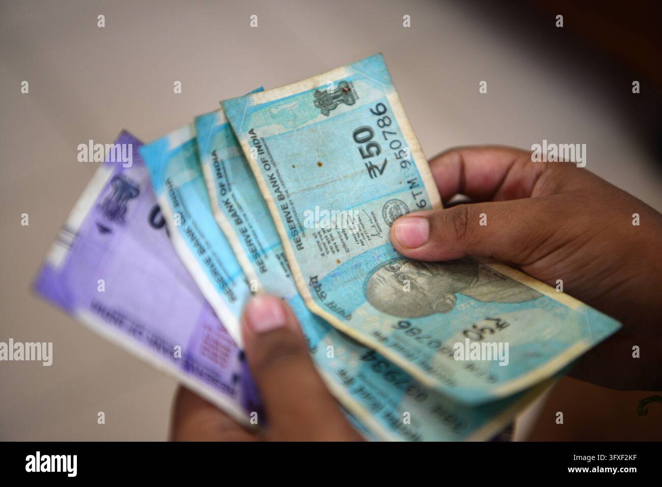 Five Rupees Note Tectocr October 23, 2026, Siliguri, West Bengal, India: An Indian boy holds as ...