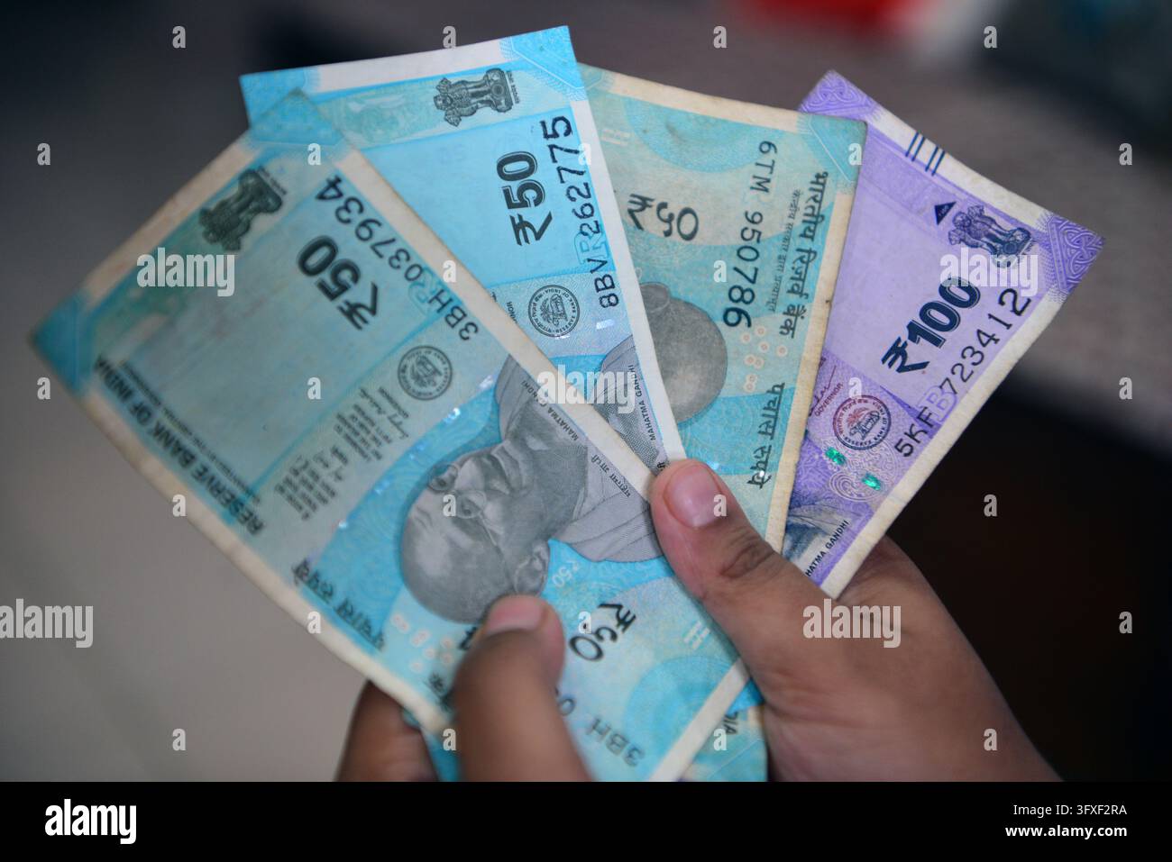 Five Rupees Note Tectocr October 23, 2026, Siliguri, West Bengal, India: An Indian boy holds as ...