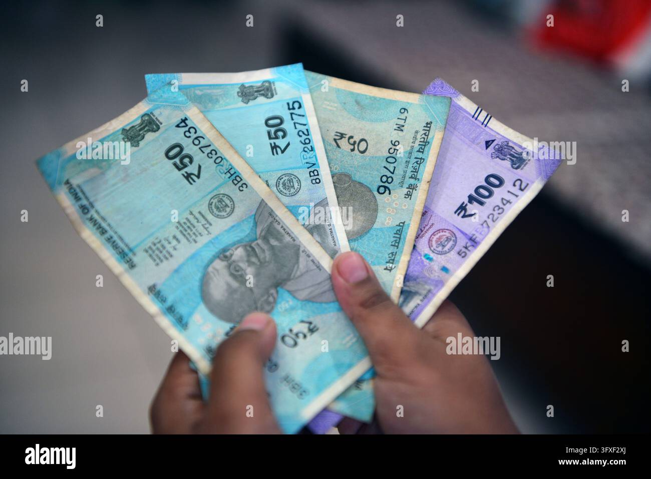 Five Rupees Note Tectocr October 23, 2026, Siliguri, West Bengal, India: An Indian boy holds as ...