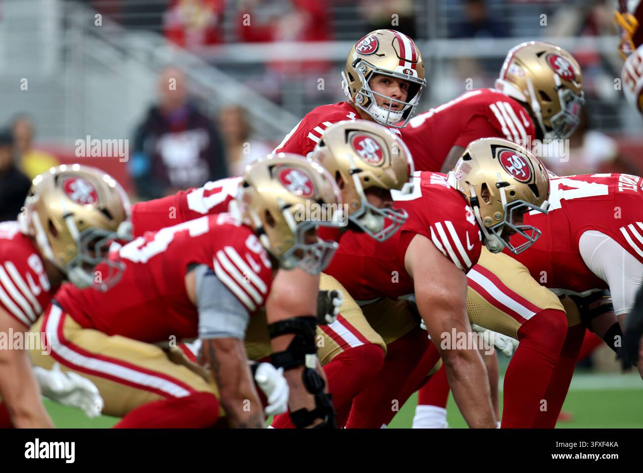 San Francisco 49ers quarterback Brock Purdy (13) looks down the line of ...