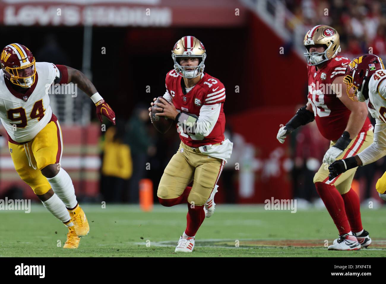 San Francisco 49ers quarterback Brock Purdy (13) runs during an NFL ...