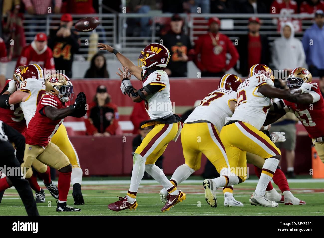Washington Commanders quarterback Jayden Daniels (5) throws during an ...