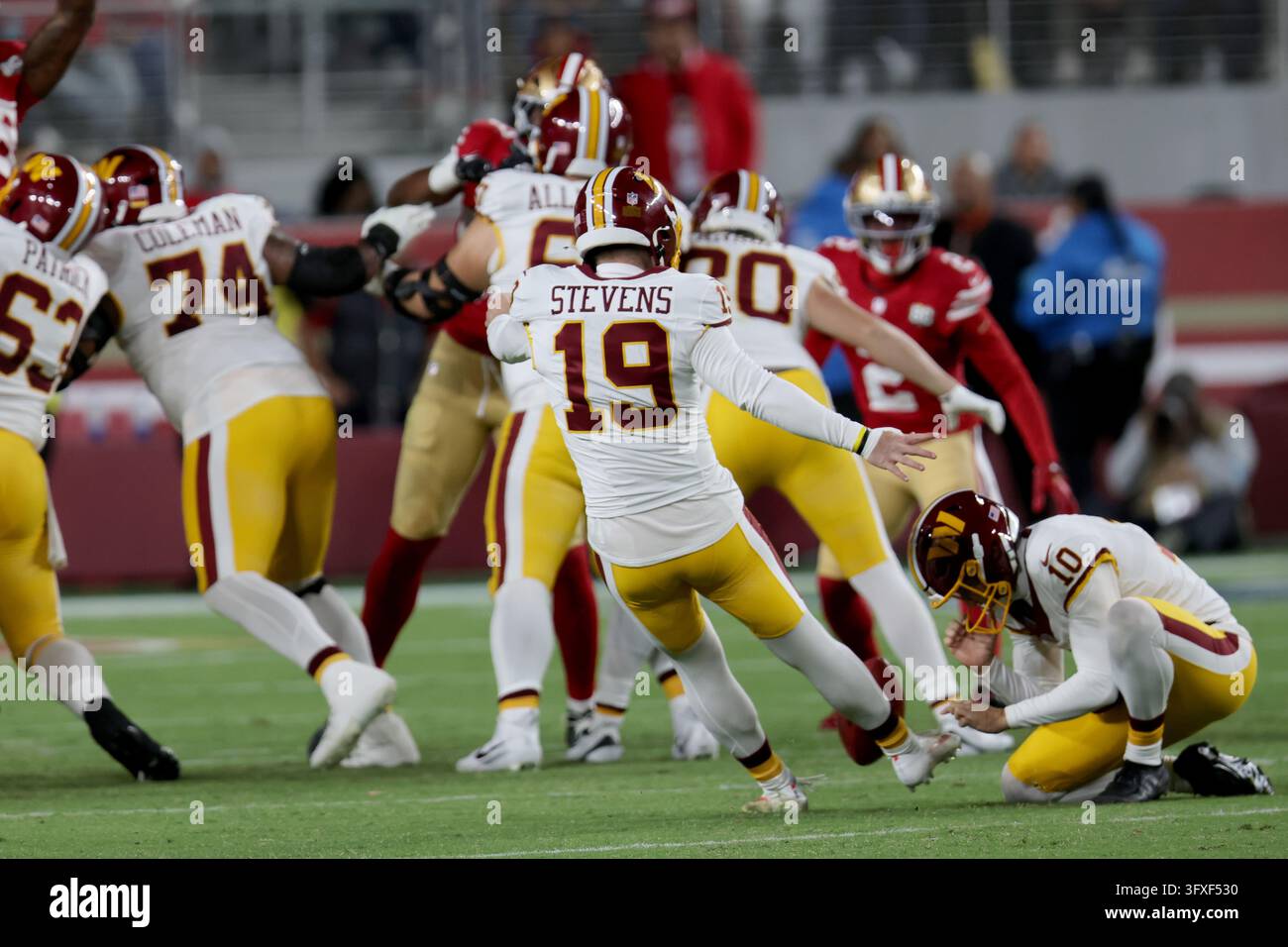 Washington Commanders place kicker Drew Stevens (19) kicks during an ...