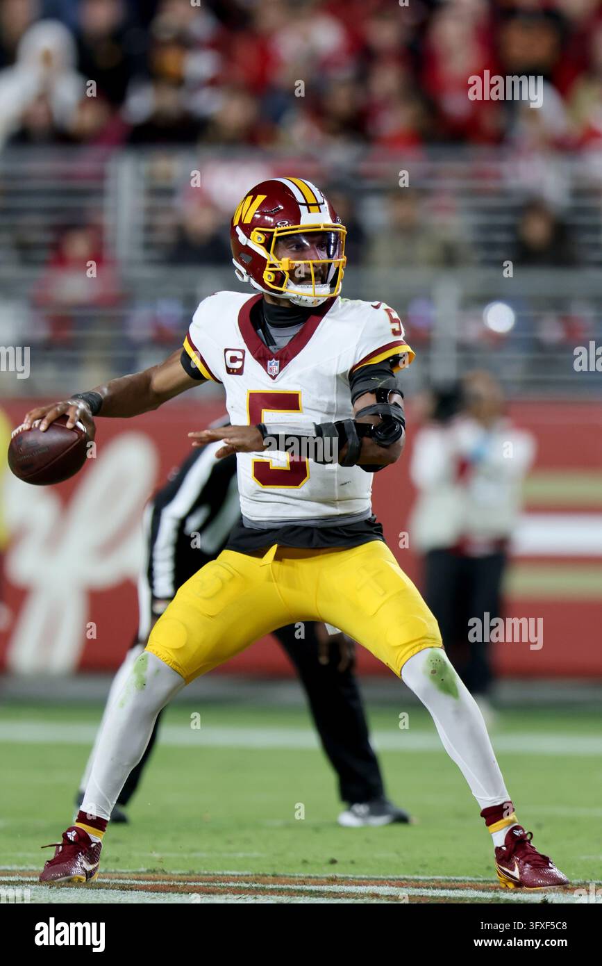 Washington Commanders quarterback Jayden Daniels (5) throws during an ...
