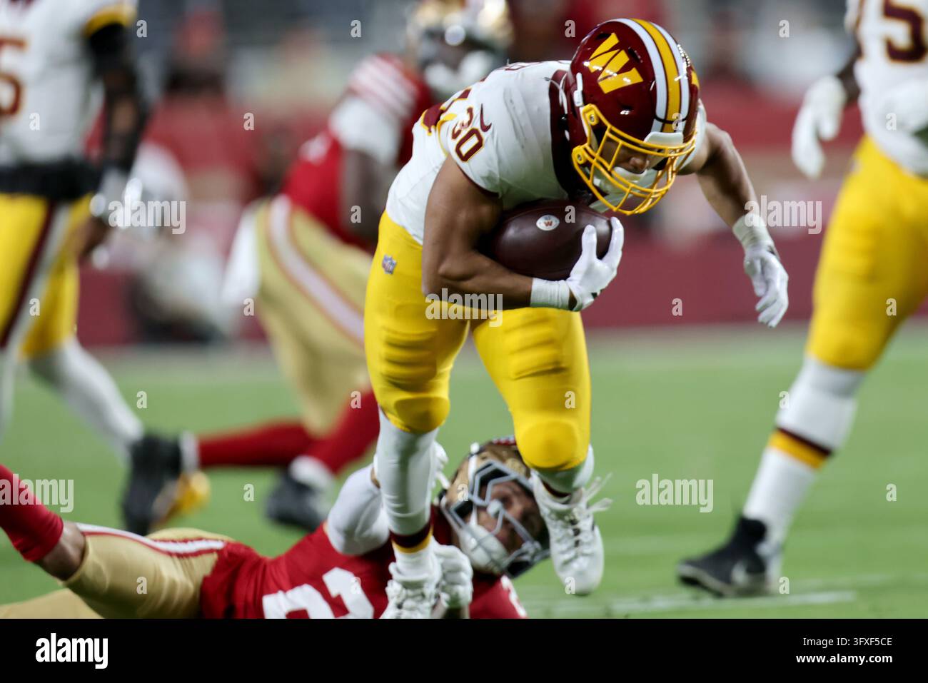 Washington Commanders running back Austin Ekeler (30) runs during an ...
