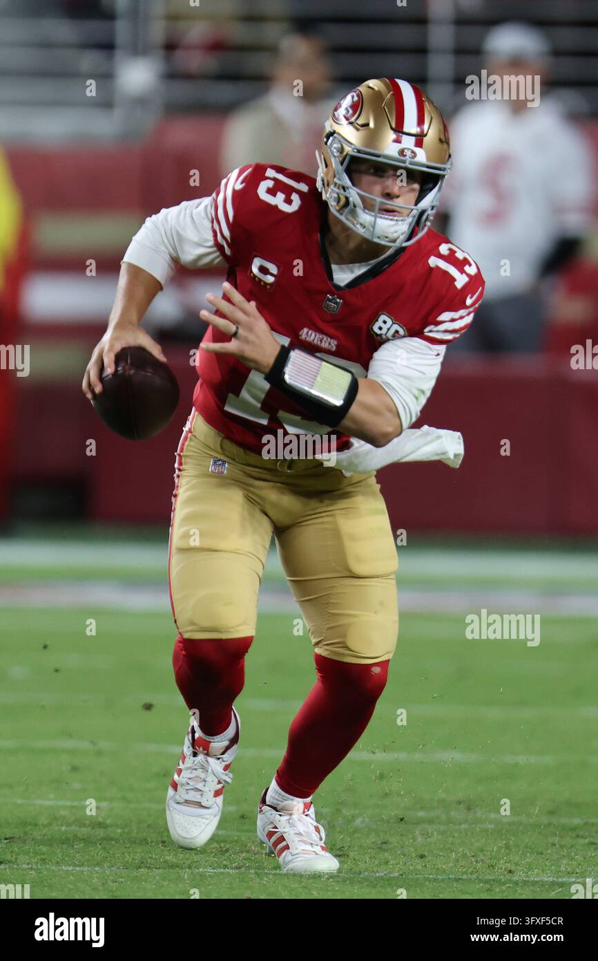 San Francisco 49ers quarterback Brock Purdy (13) runs during an NFL ...