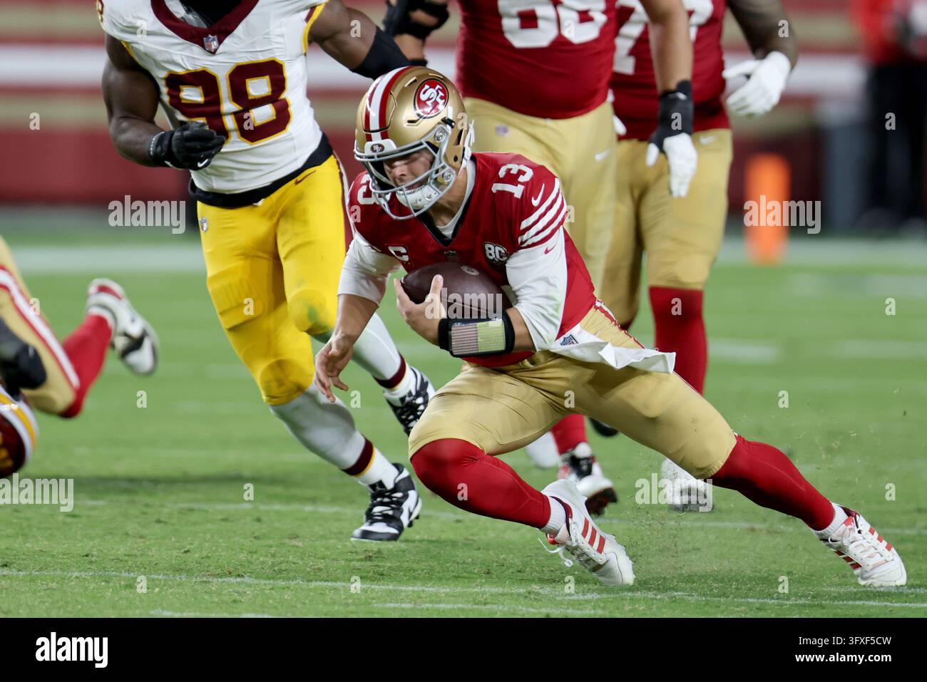 San Francisco 49ers quarterback Brock Purdy (13) runs during an NFL ...