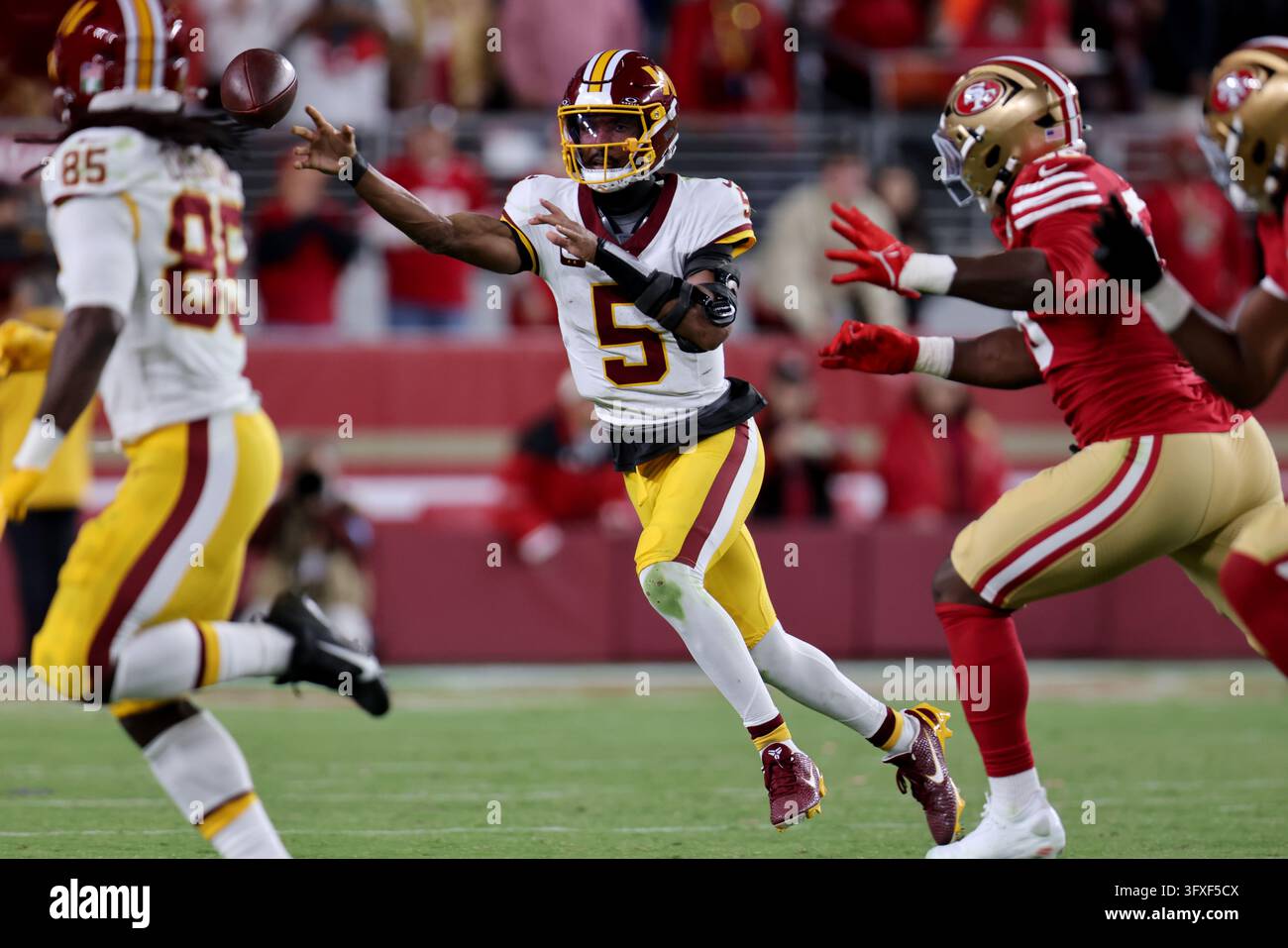 Washington Commanders quarterback Jayden Daniels (5) throws during an ...