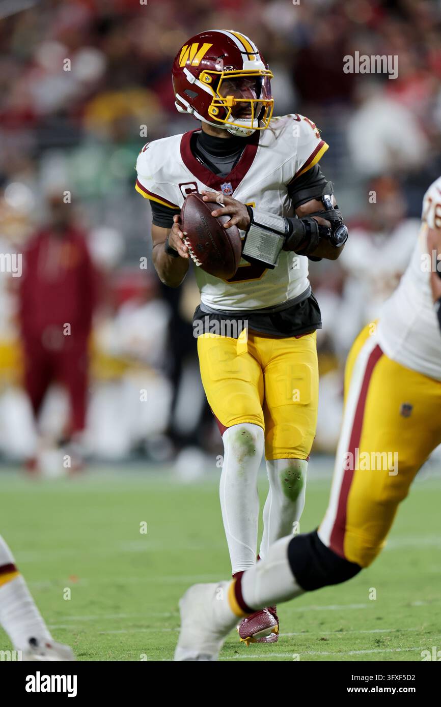 Washington Commanders quarterback Jayden Daniels (5) throws during an ...