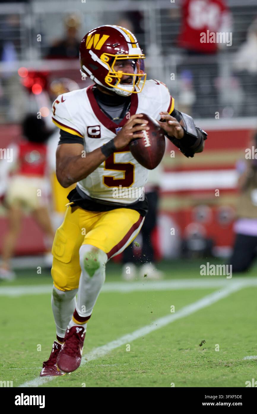 Washington Commanders quarterback Jayden Daniels (5) runs during an NFL ...