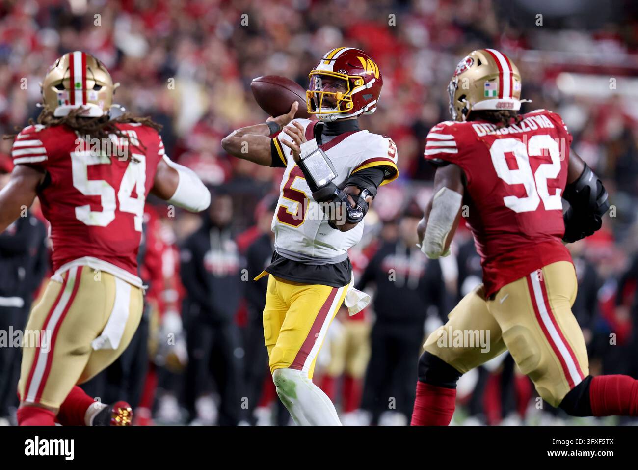 Washington Commanders quarterback Jayden Daniels (5) throws during an ...