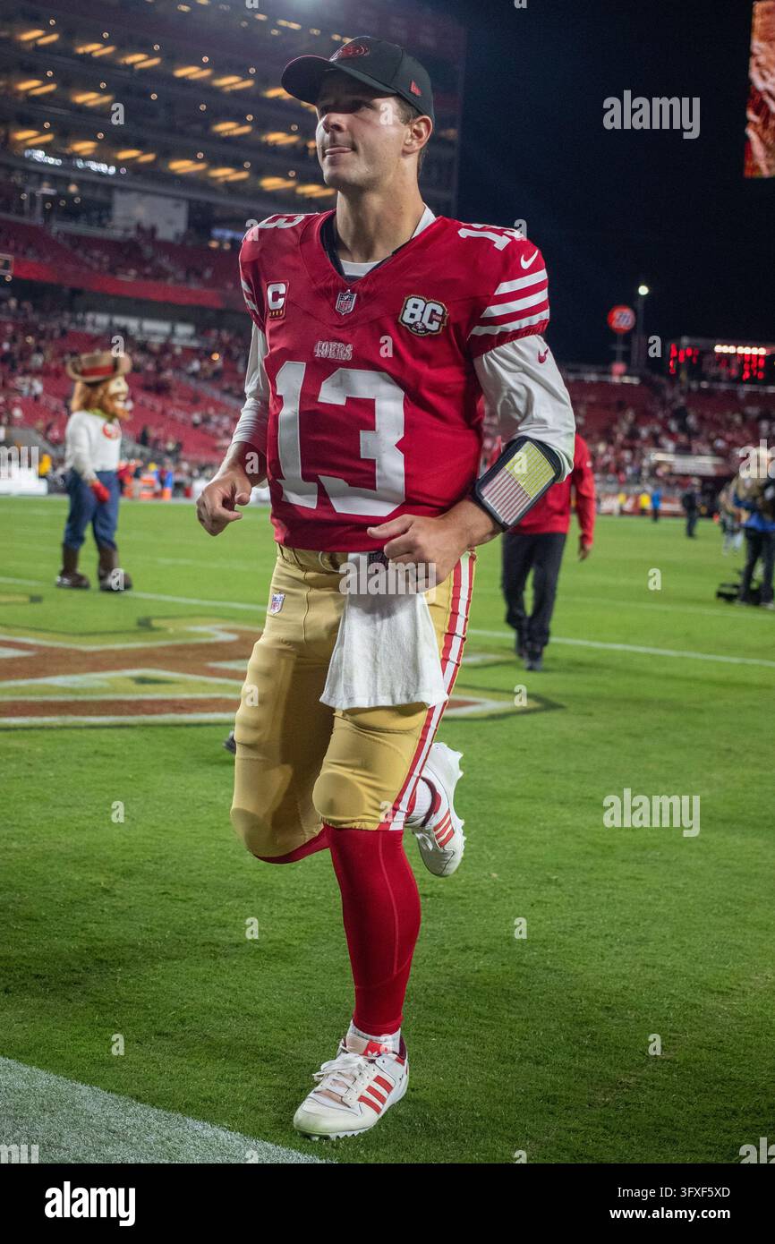 San Francisco 49ers quarterback Brock Purdy (13) runs off the field ...