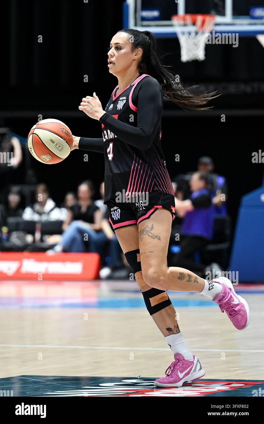 Alex Wilson of Sydney Flames controls the ball during the WNBL Round 2 ...
