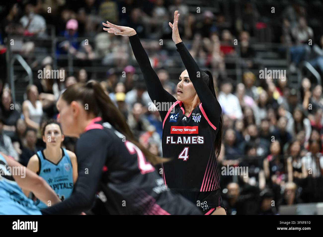 Alex Wilson of Sydney Flames has a shot for goal during the WNBL Round ...