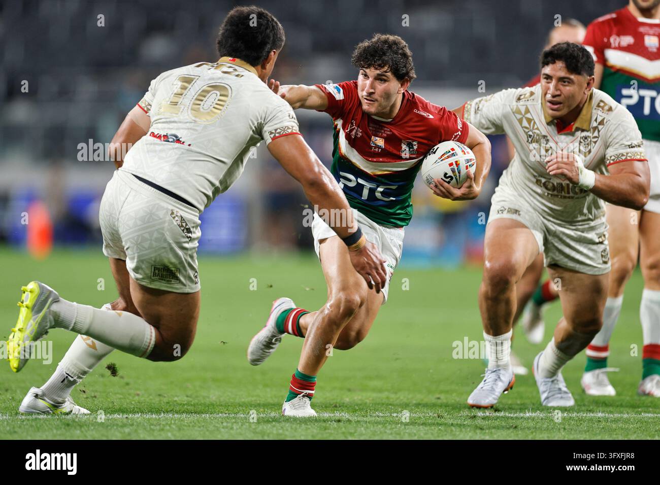 Alex Conti of Lebanon is tackled during the Men's Rugby League World ...
