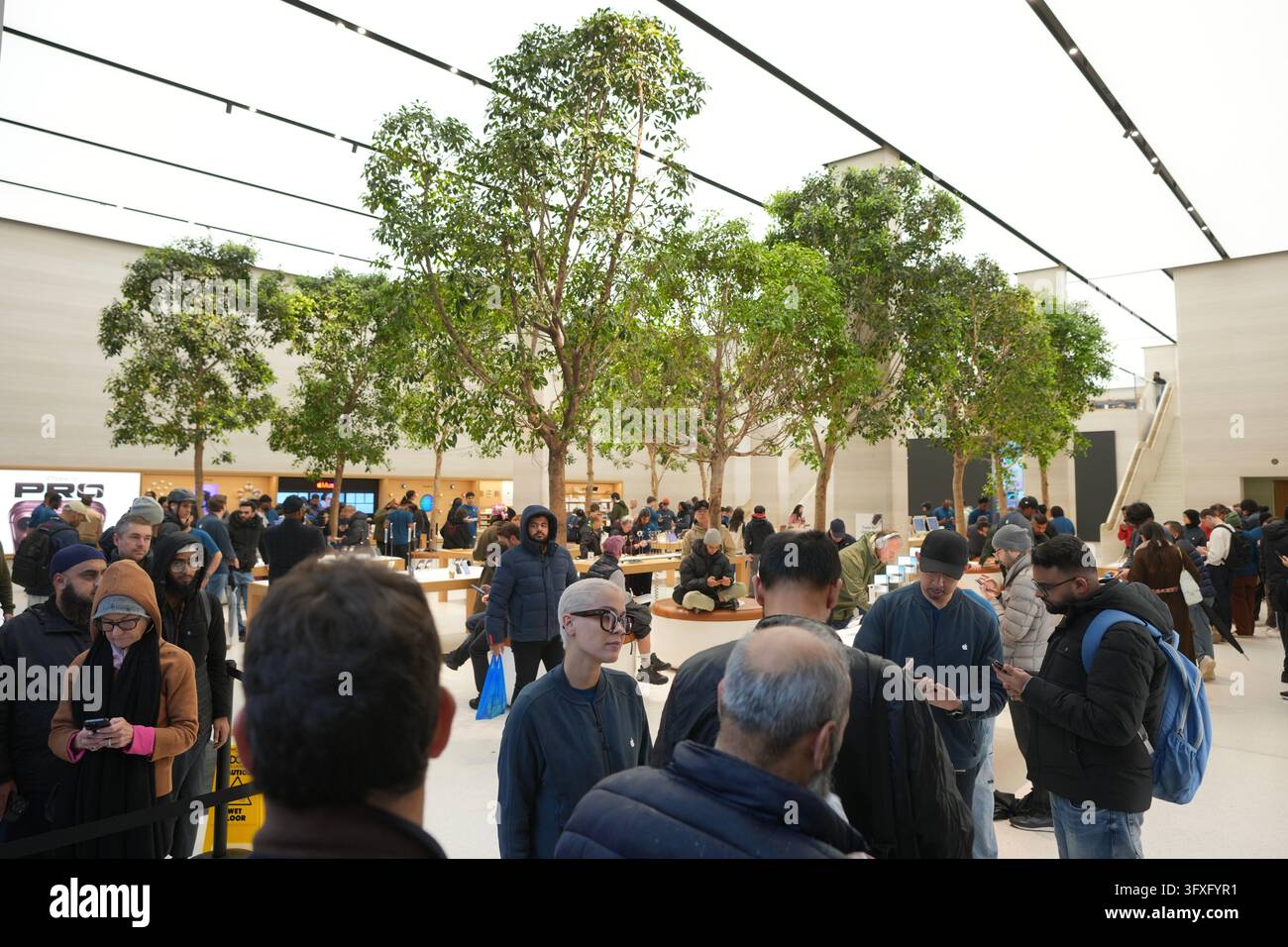 People line up to buy iPhone Duo at an Apple Store on Regent Street in ...