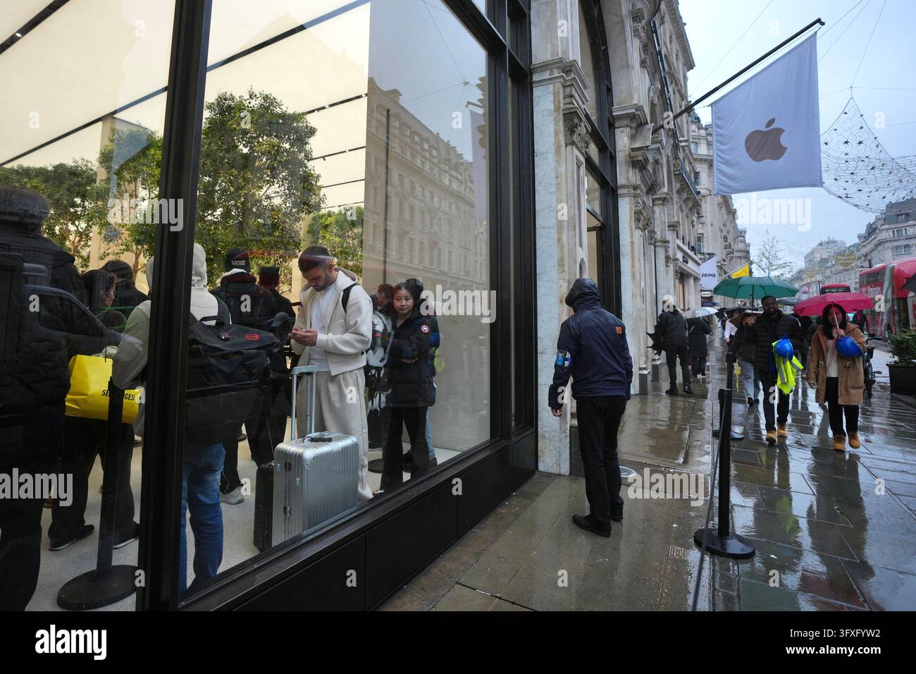 People line up to buy iPhone Duo at an Apple Store on Regent Street in ...