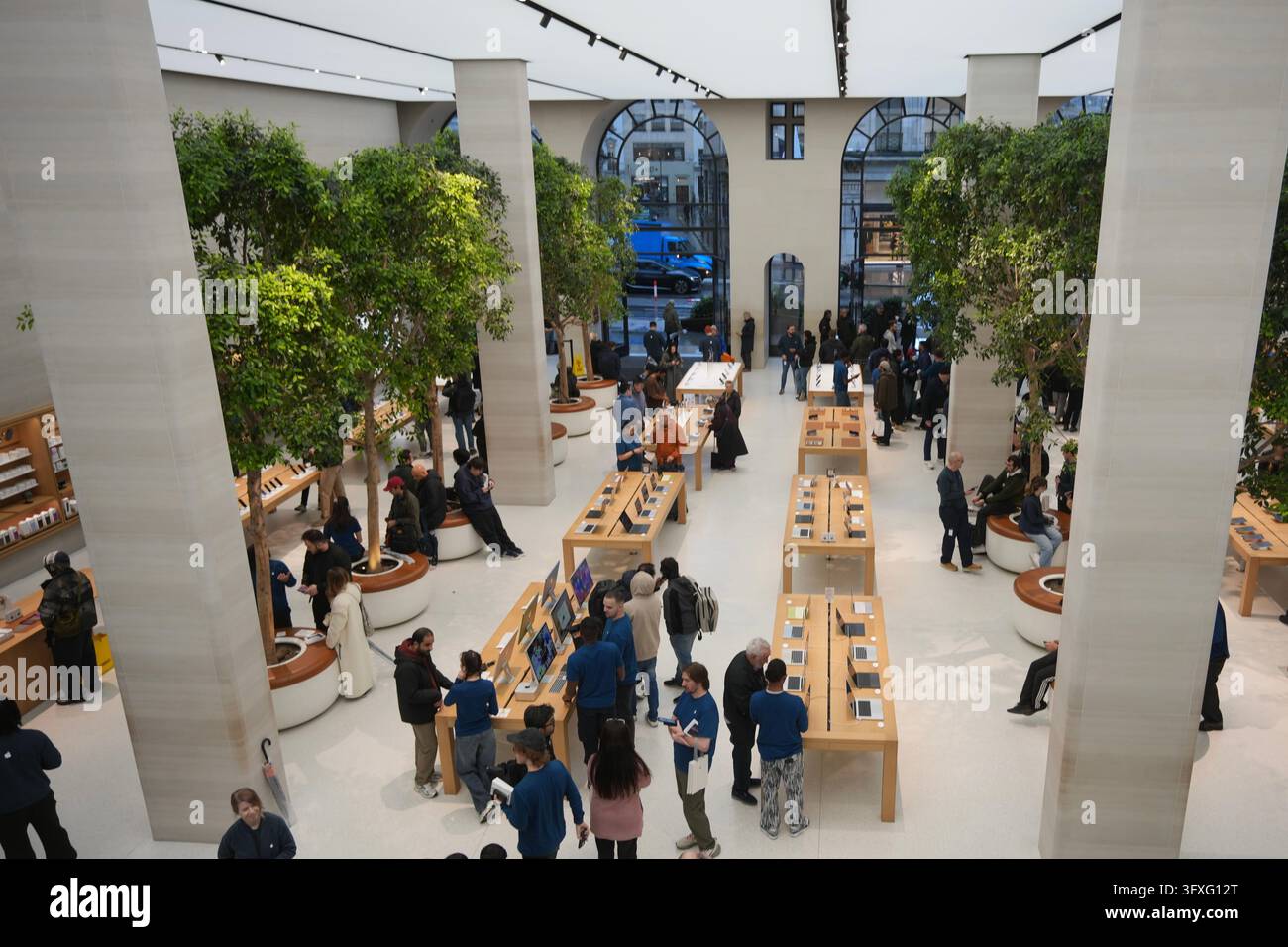 People line up to buy iPhone Duo at an Apple Store on Regent Street in ...