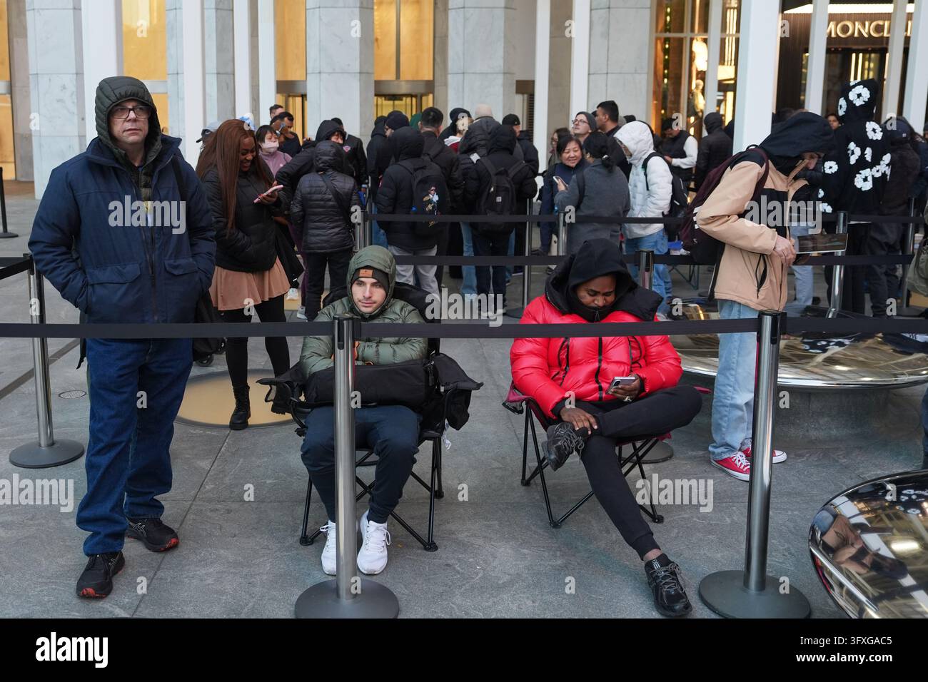 People line up outside to buy the newly-launched iPhone Duo at the ...