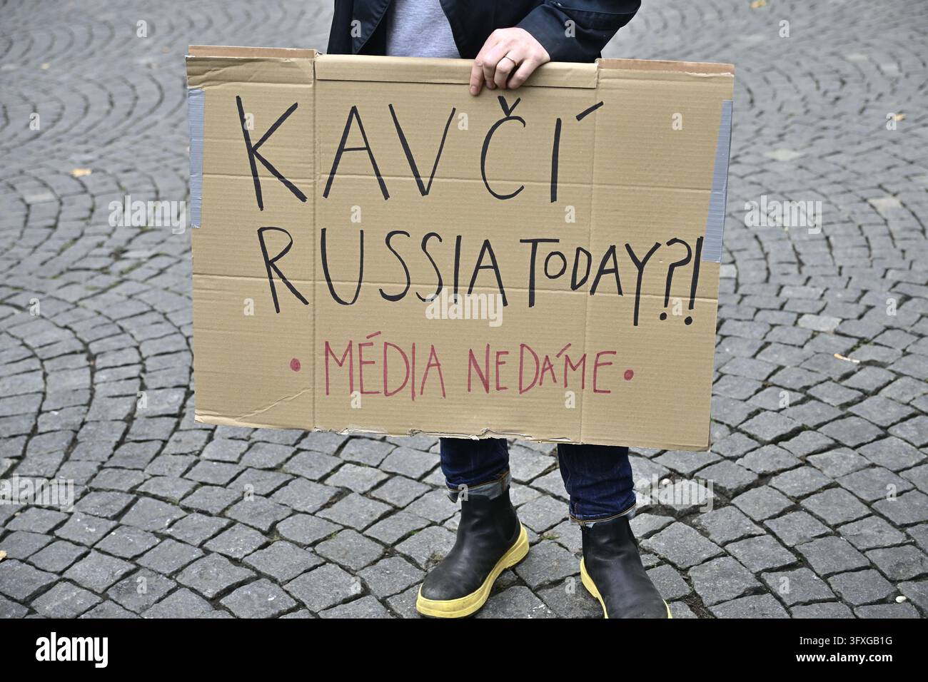 First Republic Square A man with banner demonstrates against the governing coalition's plan ...