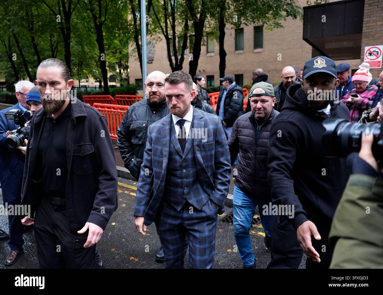 Tommy Robinson, whose real name is Stephen Yaxley-Lennon, (centre ...