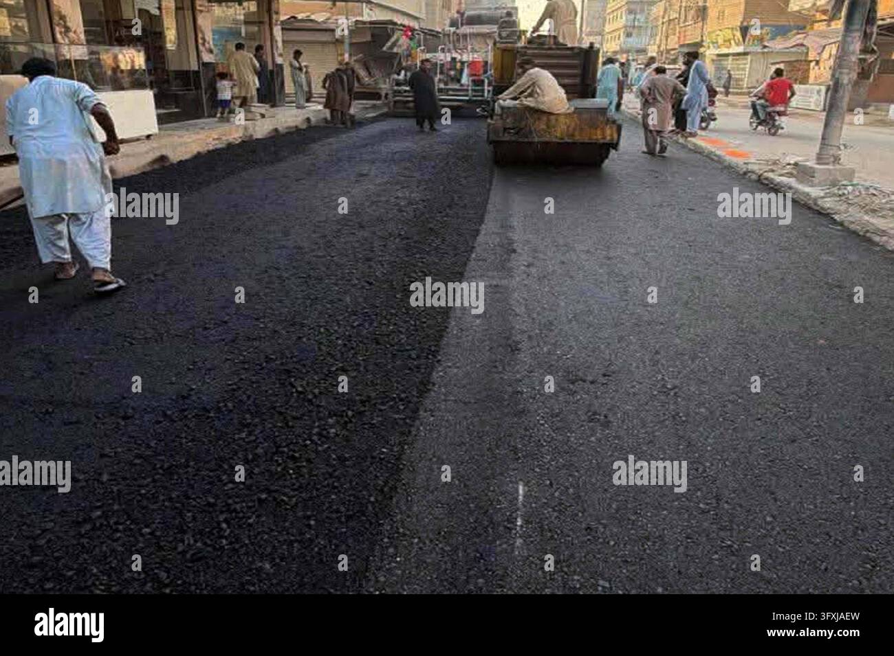 Software Development Images Yellow Local Government Department Supervises Rapid Road Carpeting ...