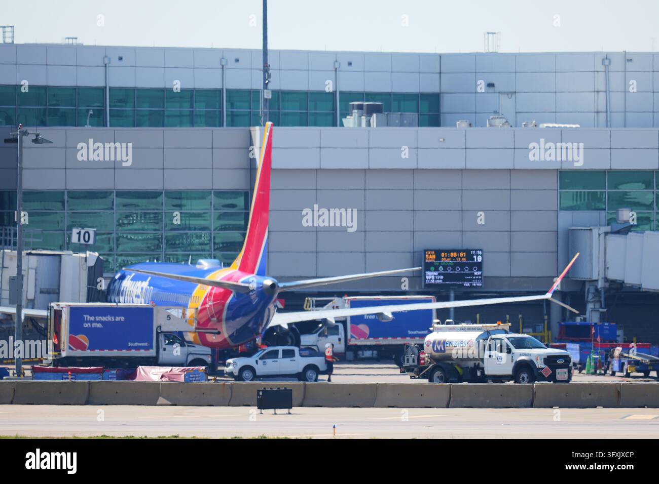 Sw Gas Utility A Menzies Aviation gas truck is seen near a Southwest Airlines plane at ...