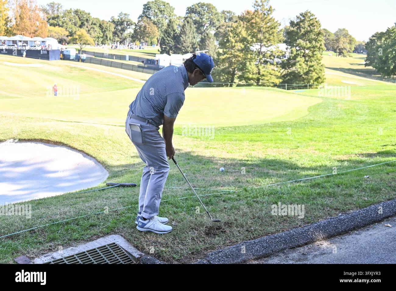 ST. LOUIS , MO - OCTOBER 23: Ken Tanigawa of the United States chips ...