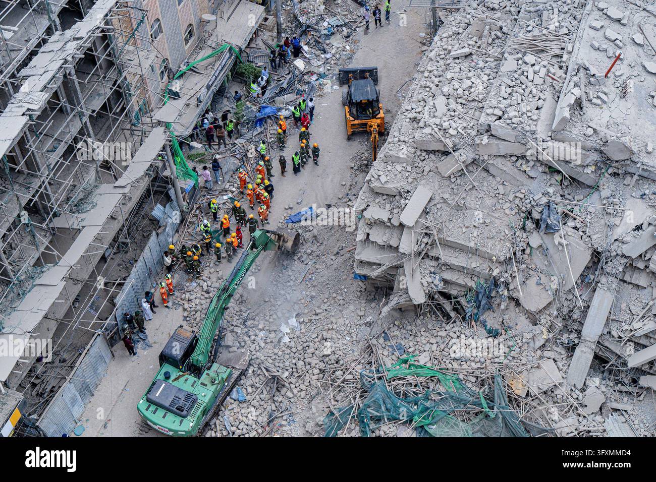 Construction Emergency Rescue Emergency teams conduct search and rescue operations at the site of a ...