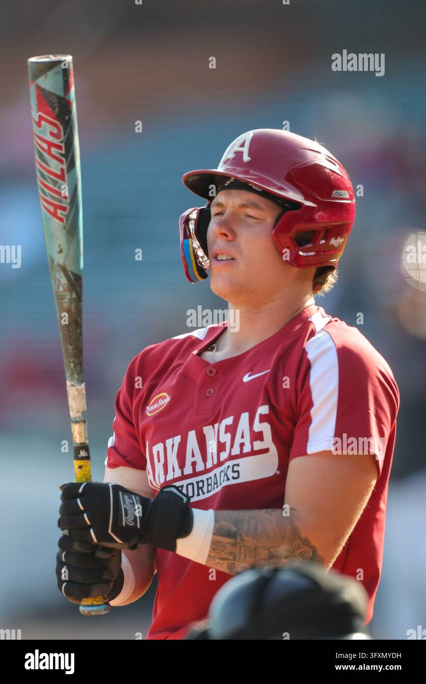 Oct 23, 2026; Carter Rutenbar (12) of Arkansas looks over his bat ...