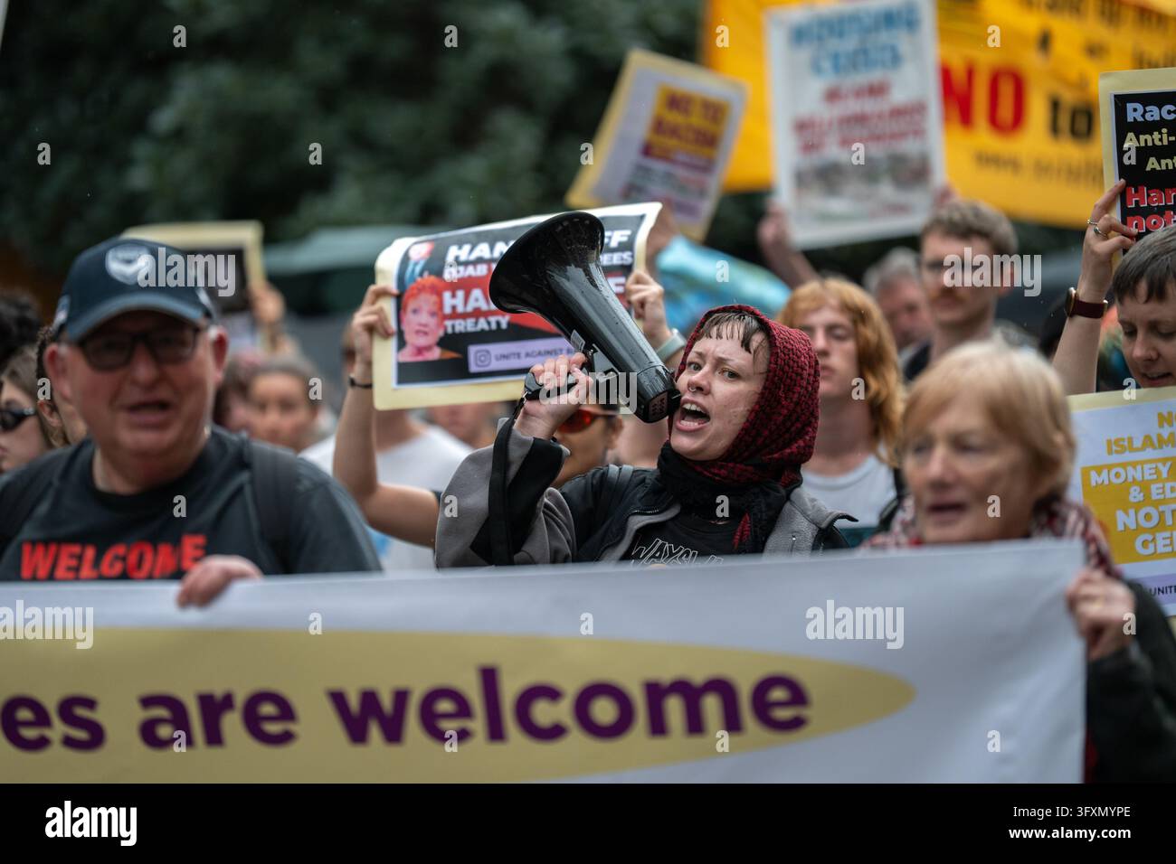 A protester chants with a megaphone during an anti-racism protest at ...