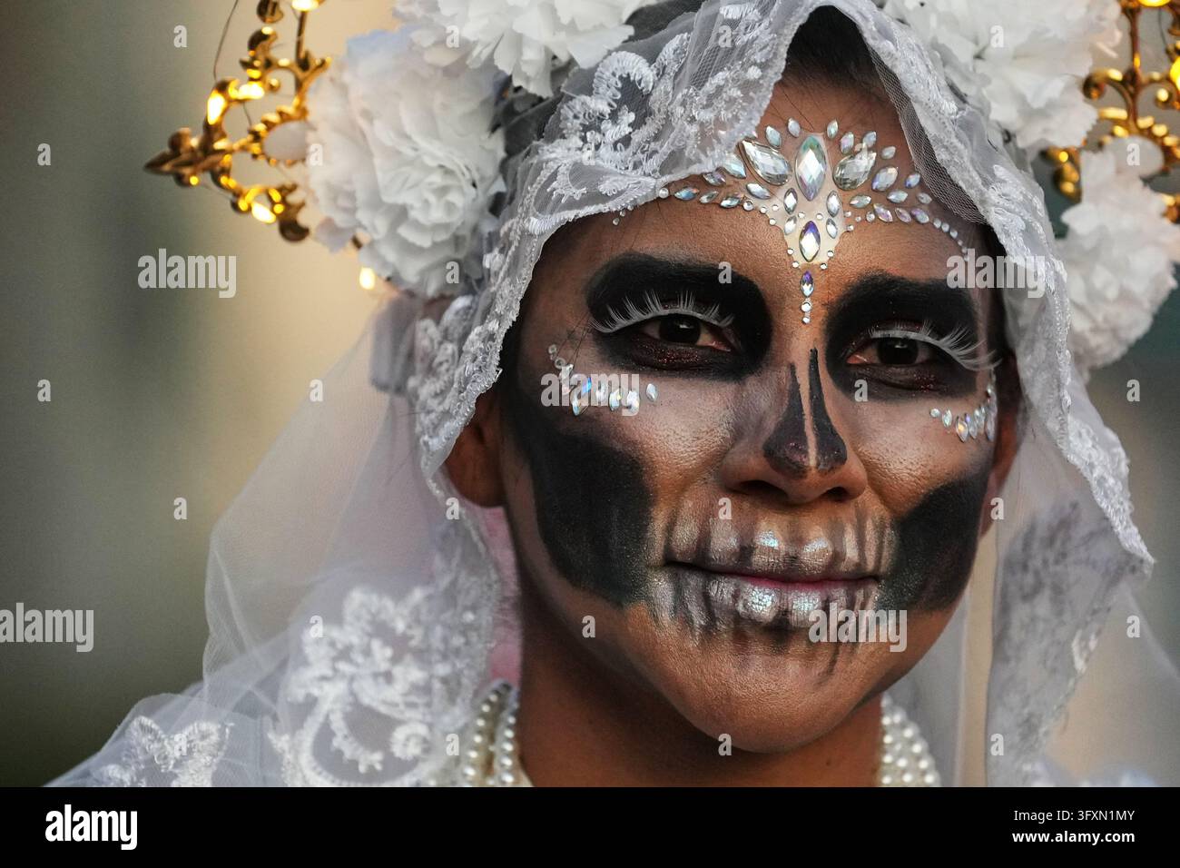 Lilian Torres poses for a photo during a Día de Muertos celebration at ...