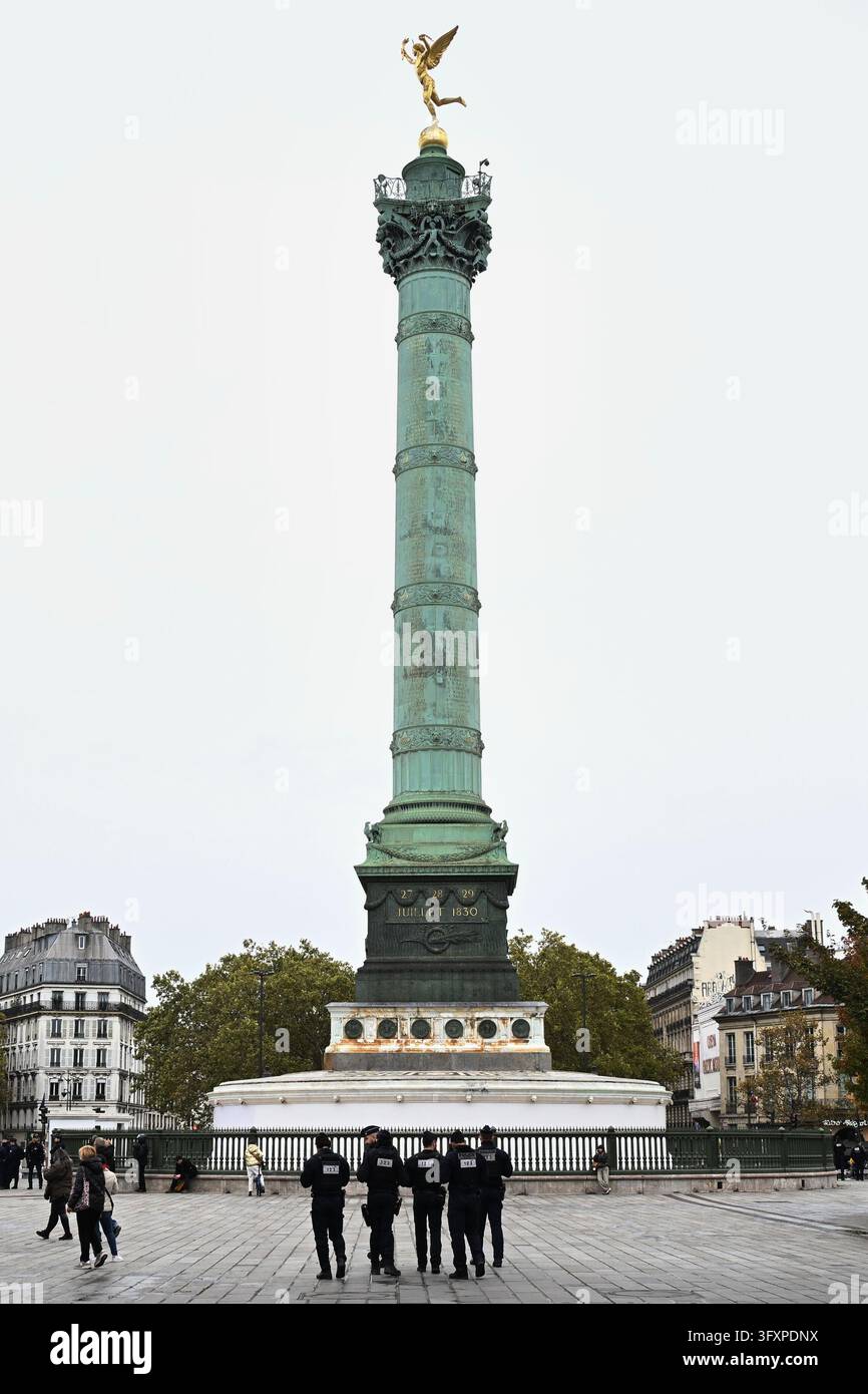 Police officers patrol the empty Bastille Square before a demonstration ...