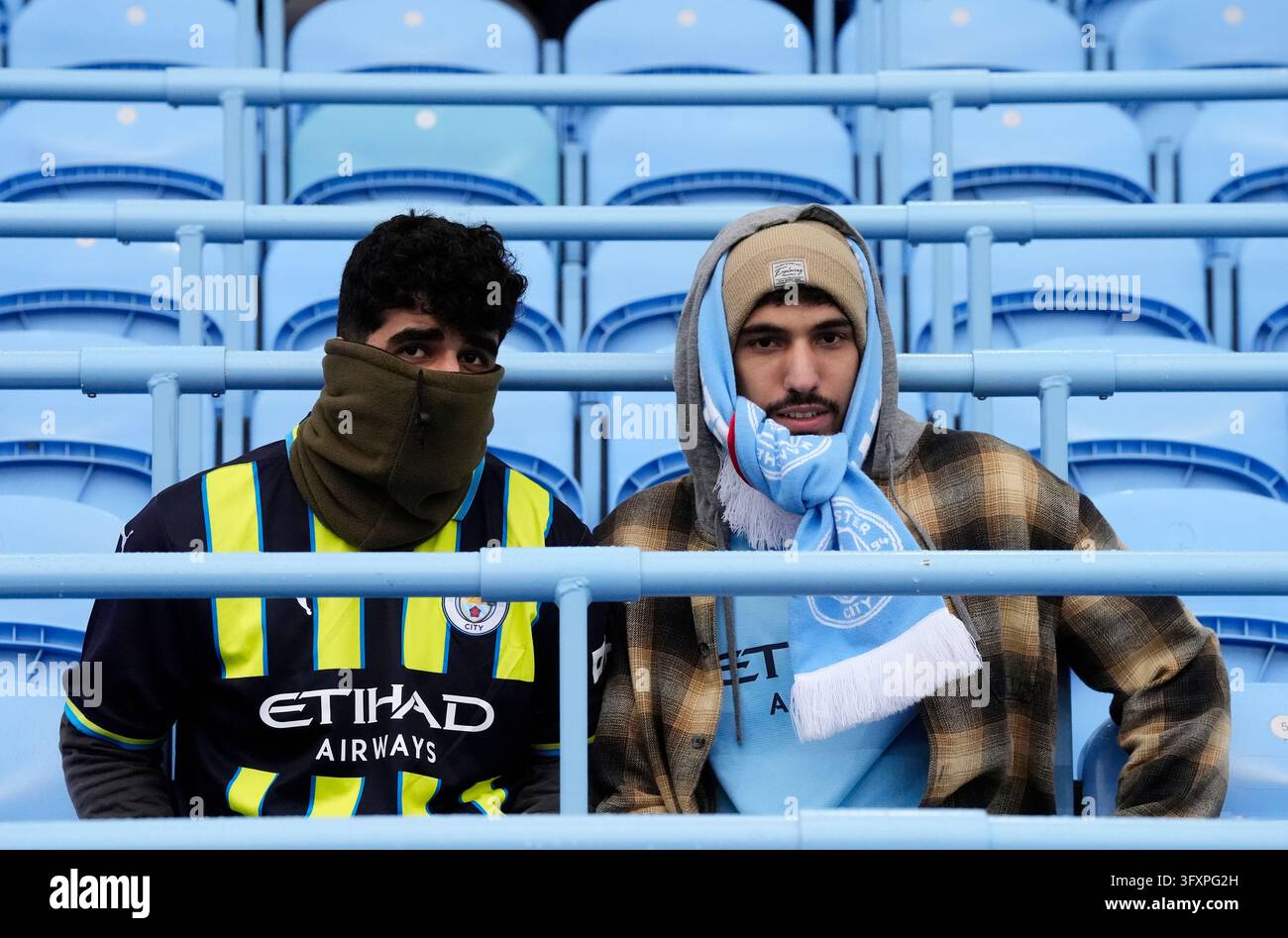 Date Image Manchester City fans braving the cold before the Premier League match ...