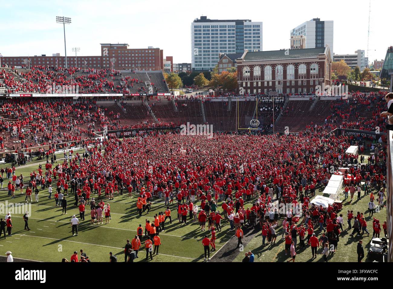 CINCINNATI, OH - OCTOBER 24: Cincinnati Bearcat fans rush the field ...