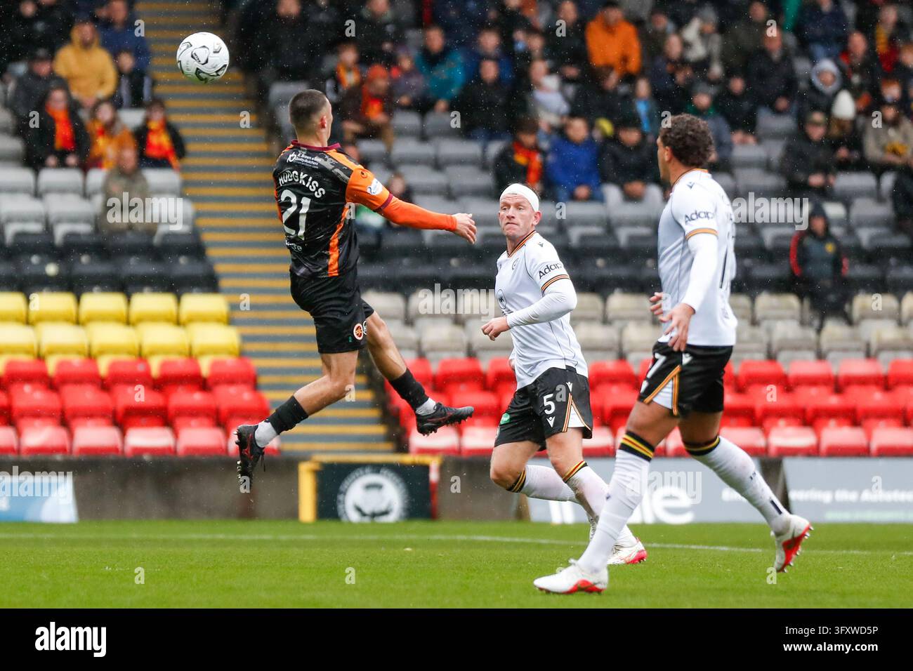 Jacobs Vector Stenhousemuir's Lewis Hodgkiss (#21) heads the ball during the William ...
