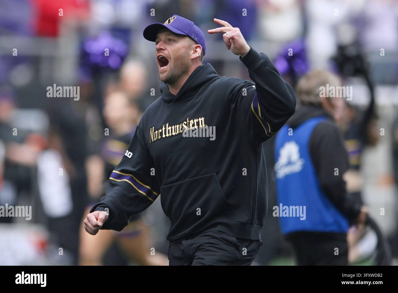 Cheer Chant Vector Northwestern head coach Dave Braun cheers before a NCAA college ...