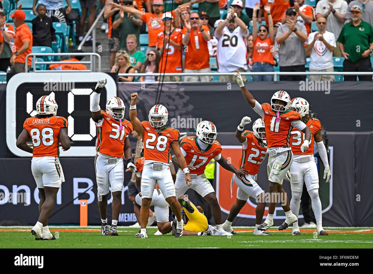 MIAMI GARDENS - OCTOBER 24: Miami's defense (pictured, defensive ...