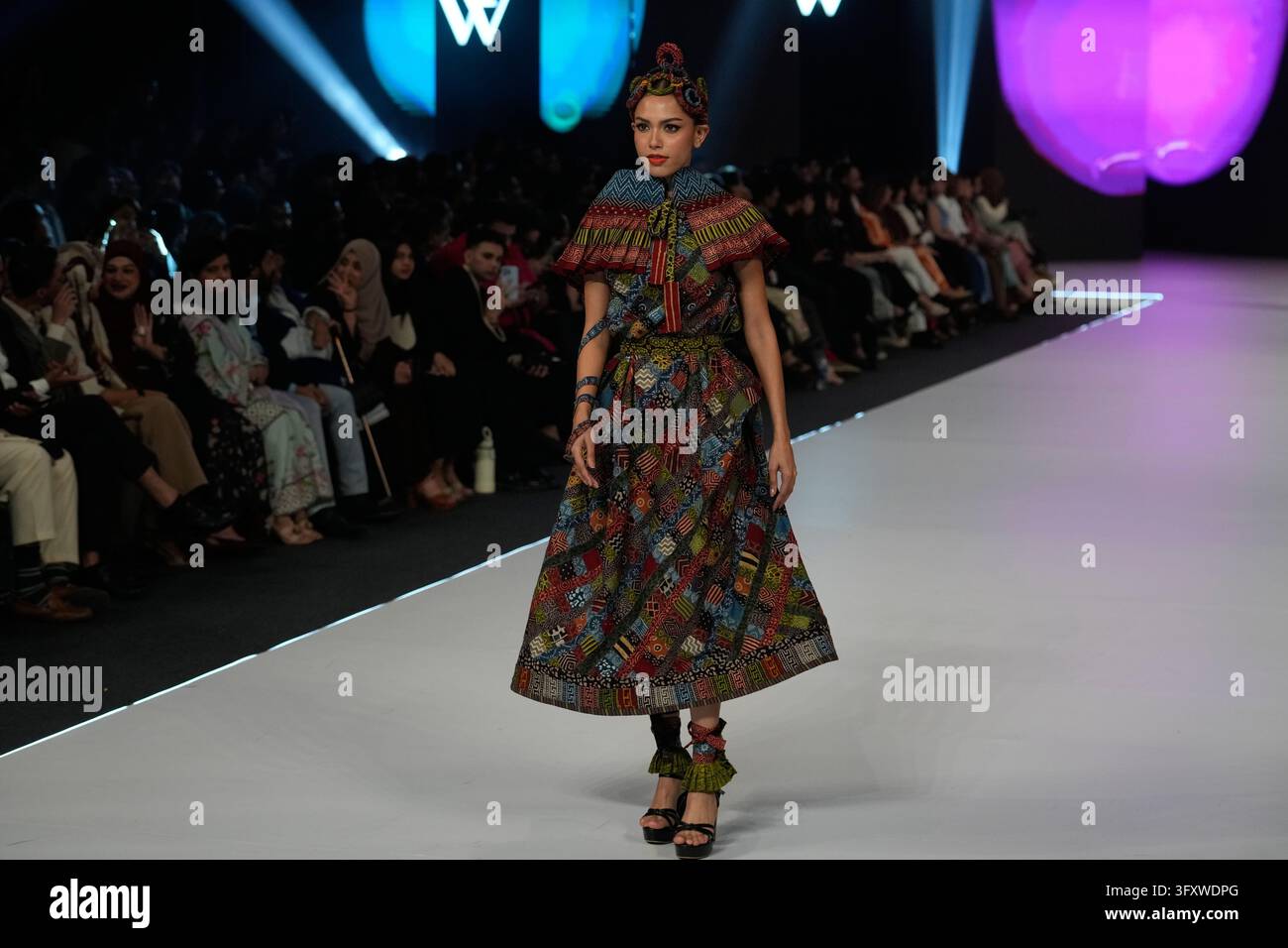 A model presents a creation by designer Yahsir Waheed during Laam ...