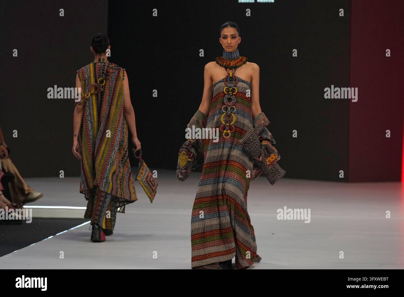 A model presents a creation by designer Yahsir Waheed during Laam ...