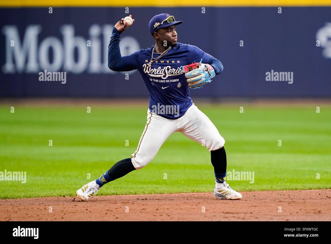 Lara Sign In Milwaukee Brewers right fielder Luis Lara warms up prior to Game 2 of ...