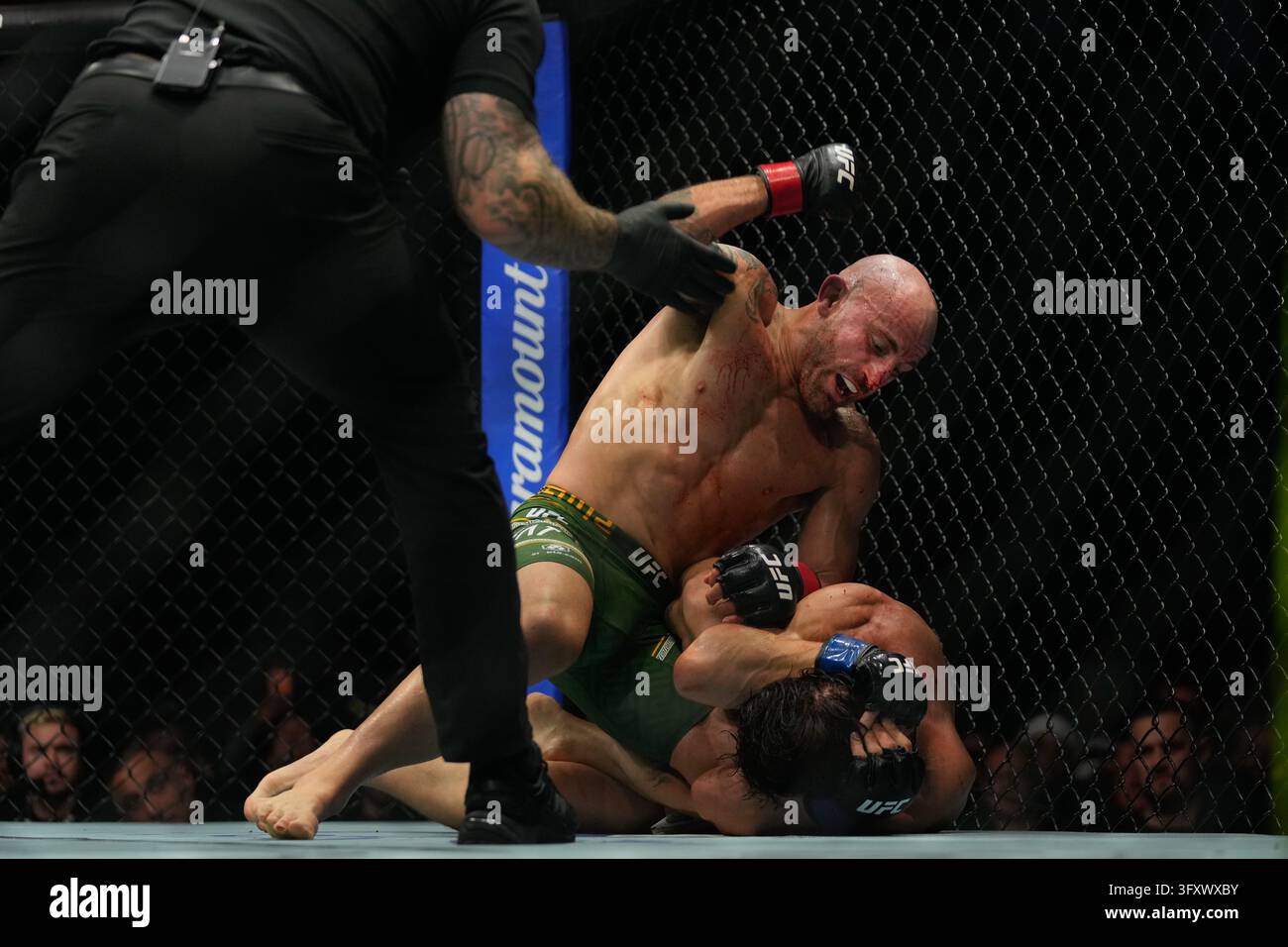 Referee stops the fight as Australia's Alexander Volkanovski, left ...