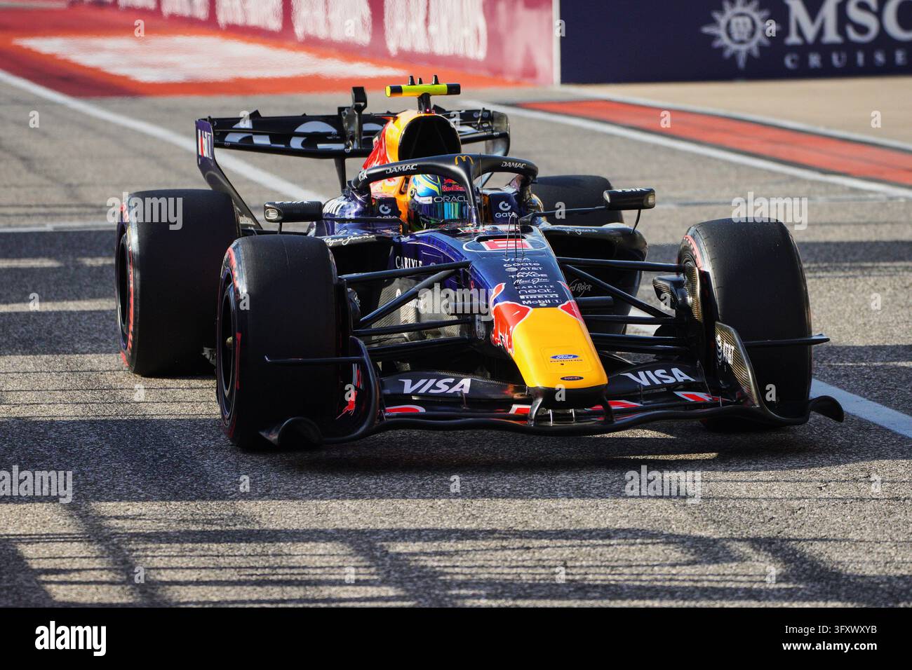 Pool Lane Size Red Bull driver Yuki Isack Hadjar of France leaves pit lane during ...
