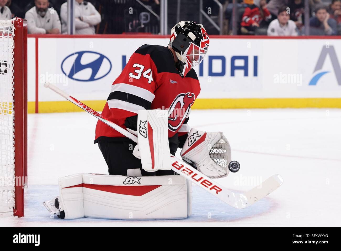 New Jersey Devils goaltender Jake Allen (34) makes a save during the ...