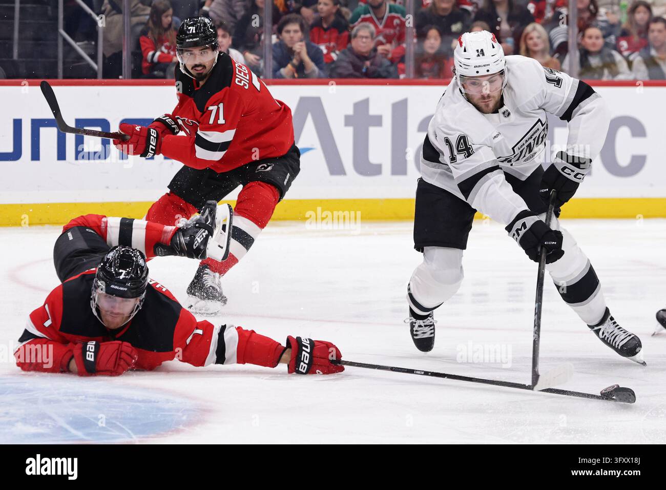 New Jersey Devils defenseman Dougie Hamilton (7) knocks the puck away ...