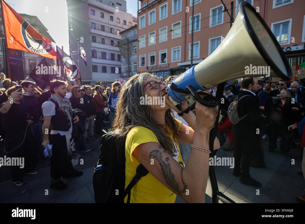 Porto, Portugal. 24th Oct, 2026. Demonstrator chants slogans through a ...