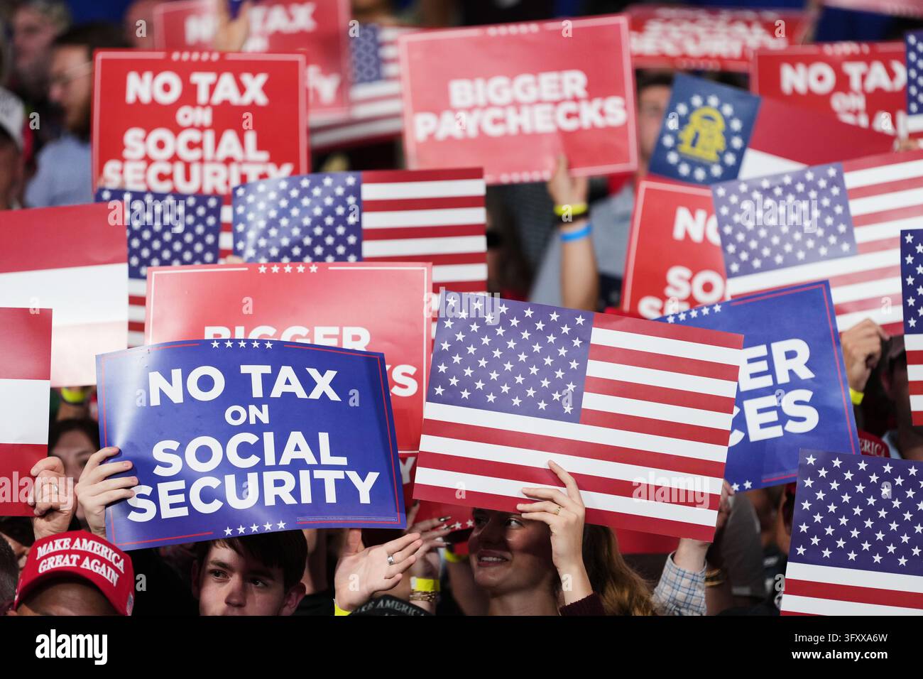 Trump X Posts People cheer and hold signs as President Donald Trump arrives at a ...